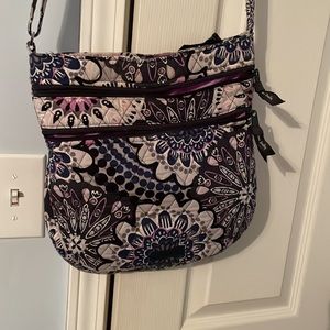 Vera Bradley purse with 3 outer pockets and one inner pocket & adjustable strap